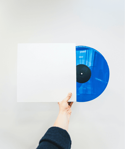 Man Holding Vinyl Record Cover