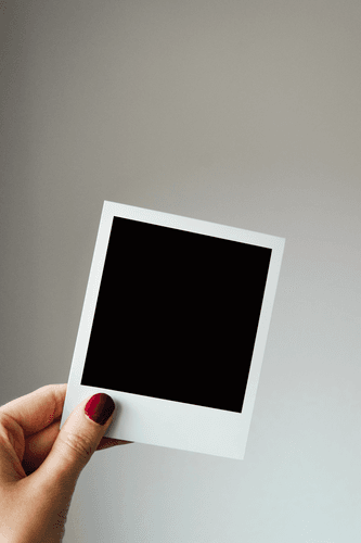 Hand Holding Polaroid Mockup