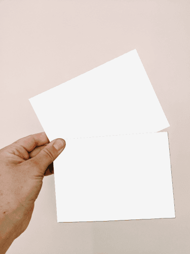 Man Holding Greeting Card Mockup